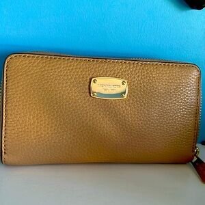 Michael Kors tan wallet.